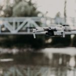Drone conducting an aerial inspection of a bridge