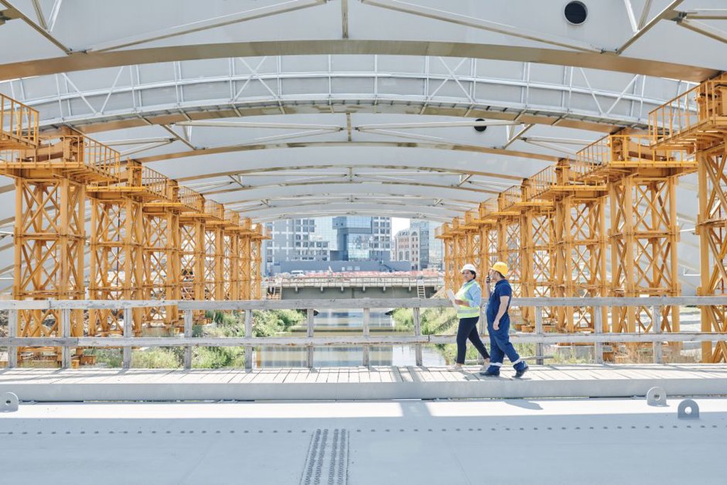 A drone conducting a bridge inspection capturing detailed images