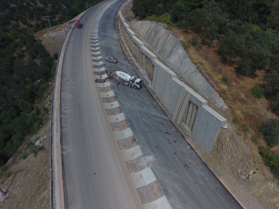 Engineers conducting soil tests at a road construction site