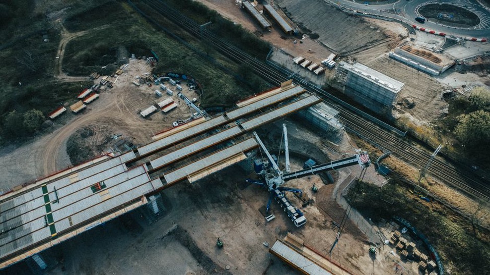 Equipment working near an unfinished bridge approach