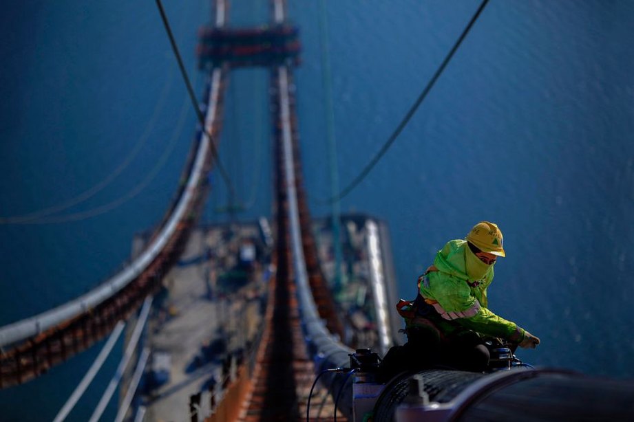 Close inspection of bearings beneath a bridge span