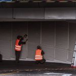 Technician checking a bridge deck drain