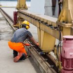 Engineers inspecting a bridge with diagnostic tools