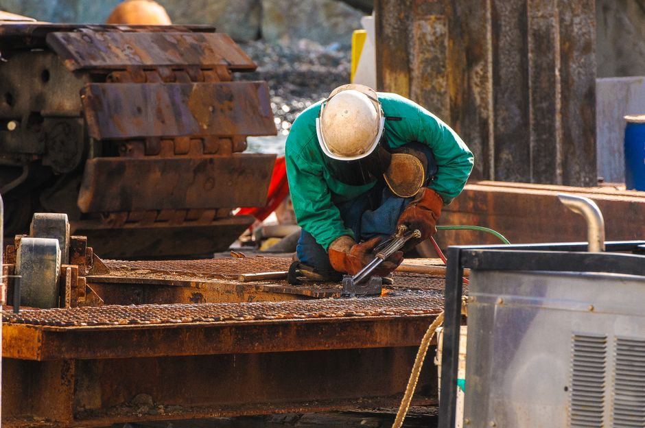 Inspector examines a steel bridge connection