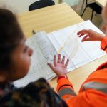 Engineers comparing site evidence with a project risk register