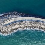 Rock armour protects a road embankment from waves
