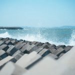 Geotextiles and rock armor stabilizing a coastal road