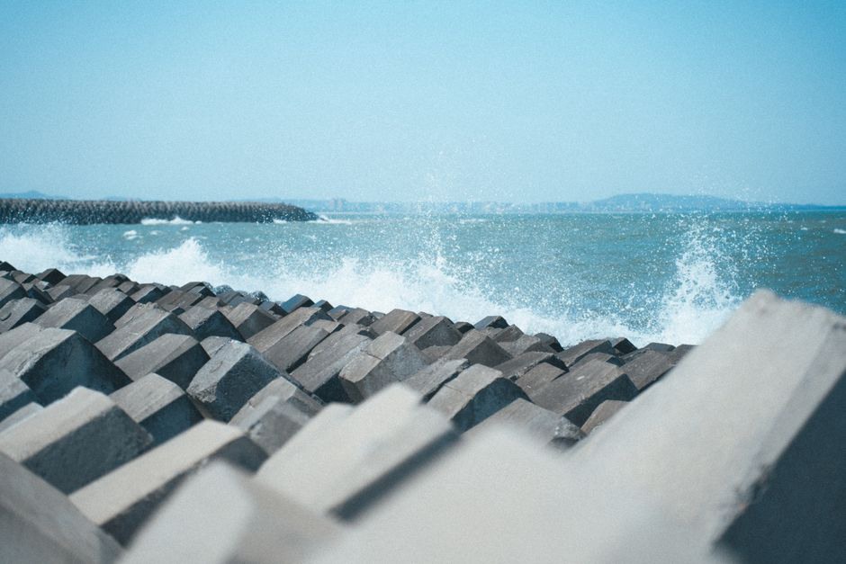 Geotextiles and rock armor stabilizing a coastal road