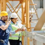 Engineers reviewing seismic design plans for a bridge