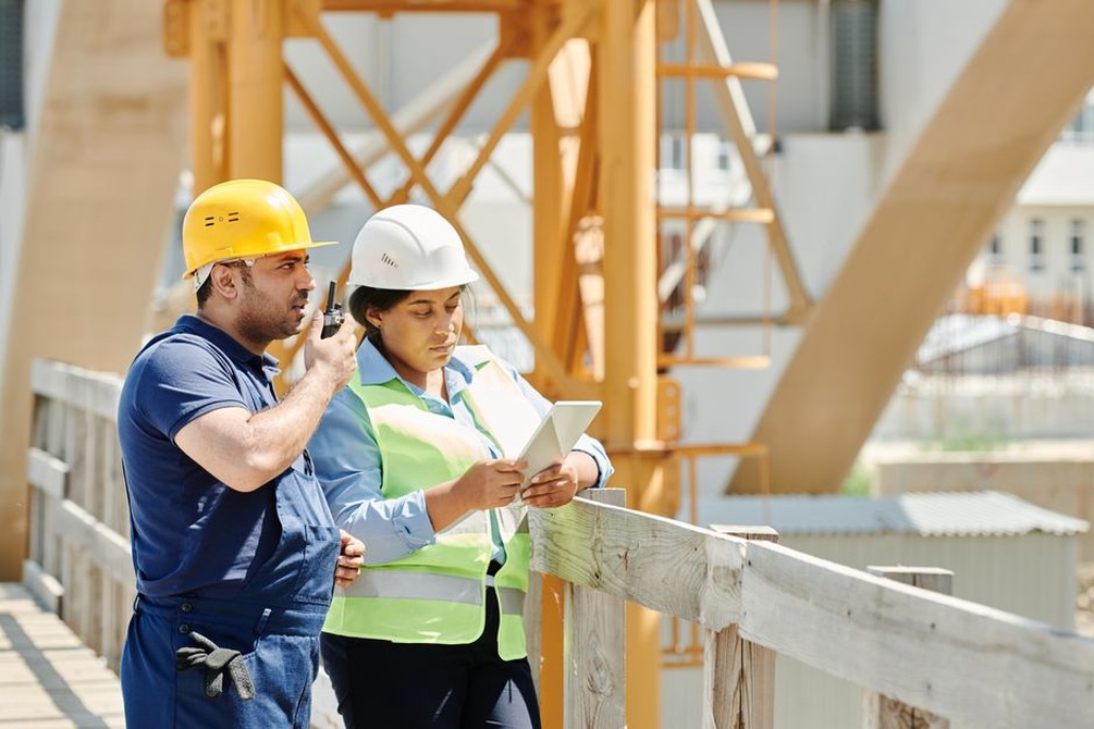 Engineers reviewing seismic design plans for a bridge