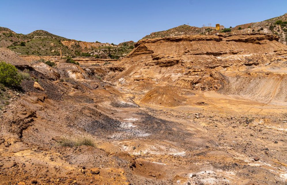 Exposed ground layers beside a road cutting