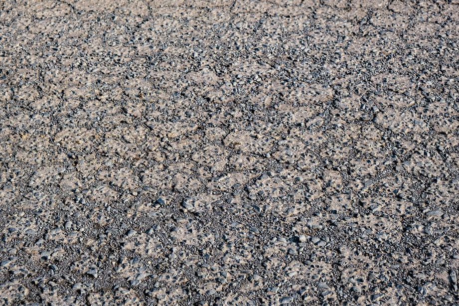 Geotextile separating aggregate from soft road subgrade
