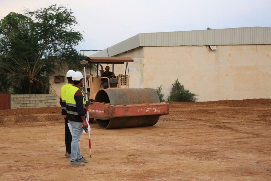 Field crew interpreting subsurface pavement survey data