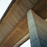 Seismic bearings installed beneath a highway bridge