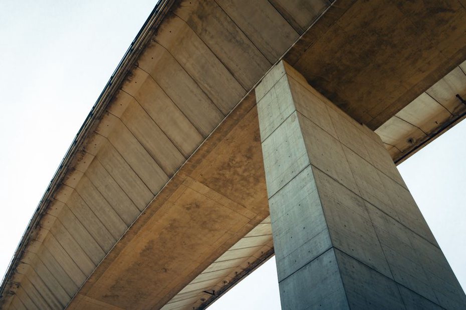 Seismic bearings installed beneath a highway bridge