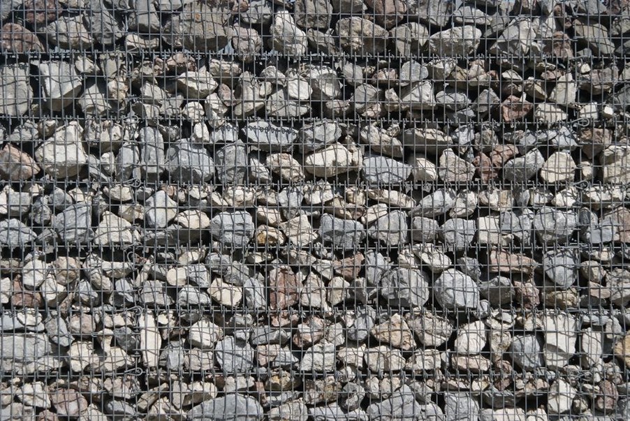 Drained highway cut with protective slope treatment