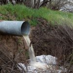 Roadside channel directing runoff toward a culvert