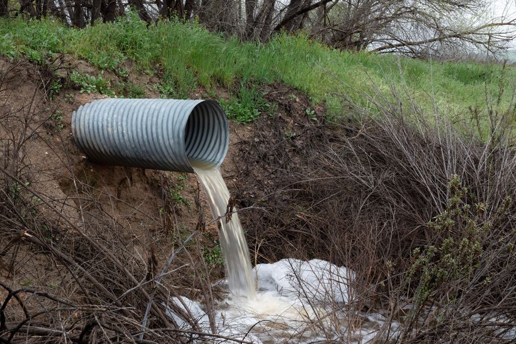 Roadside channel directing runoff toward a culvert