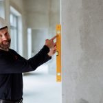 Engineer documenting crack geometry on a concrete deck