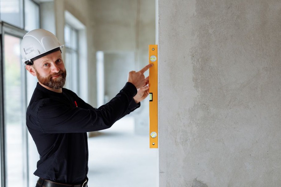 Engineer documenting crack geometry on a concrete deck