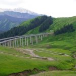 Road and rail infrastructure share a narrow mountain valley