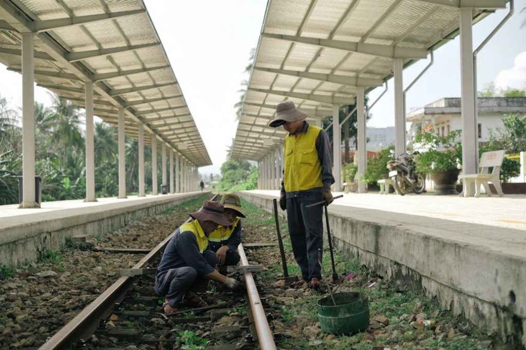 Engineers assessing railway track foundations
