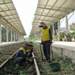Engineers assessing railway track foundations