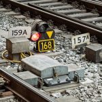 Track renewal equipment working along a rail corridor