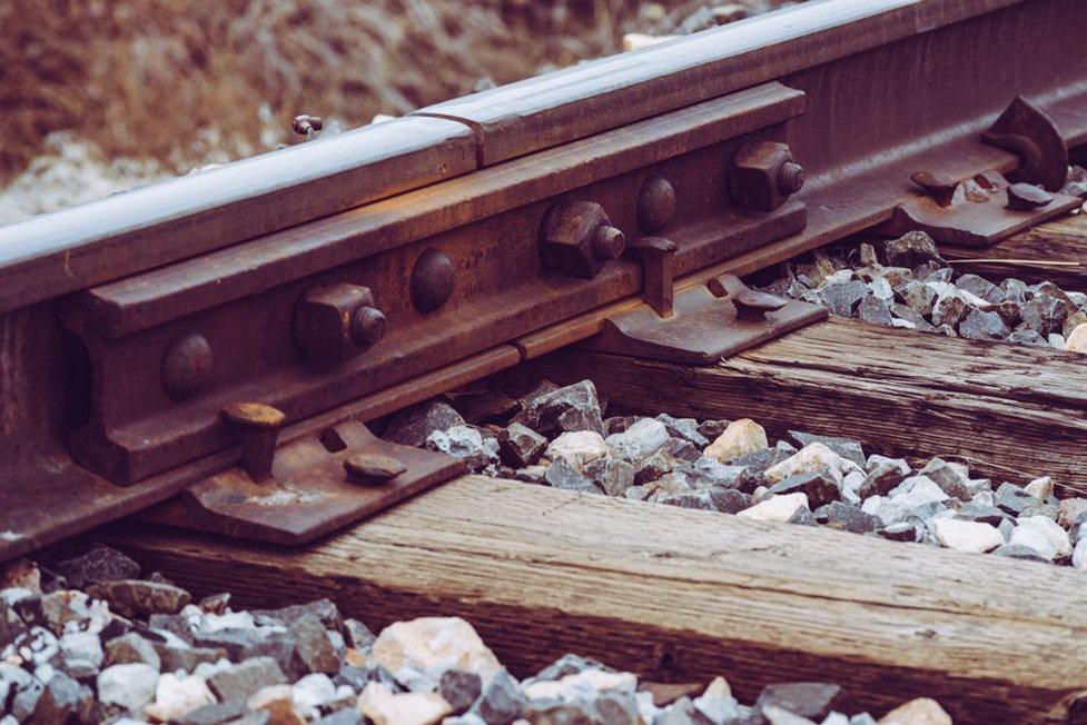 Ballasted track layers transferring load into prepared ground