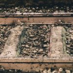 Ballast layers exposed beneath a railway track