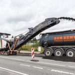 Reclaimed asphalt being processed for pavement reuse