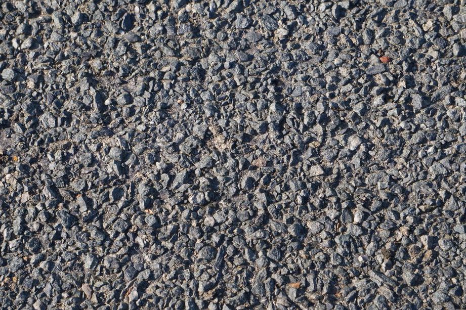 Geogrid beneath aggregate during road construction