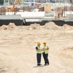 Engineers conducting a geotechnical survey at a road construction site