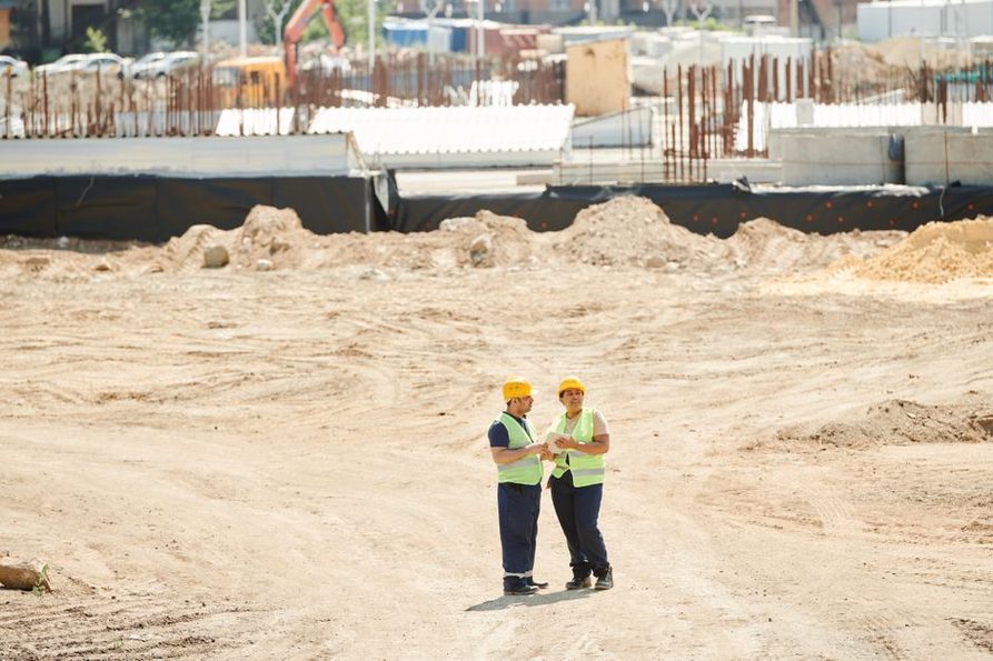 Engineers conducting a geotechnical survey at a road construction site
