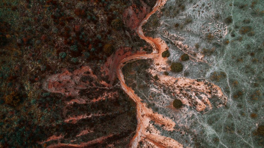 Runoff channel cutting into a roadside embankment