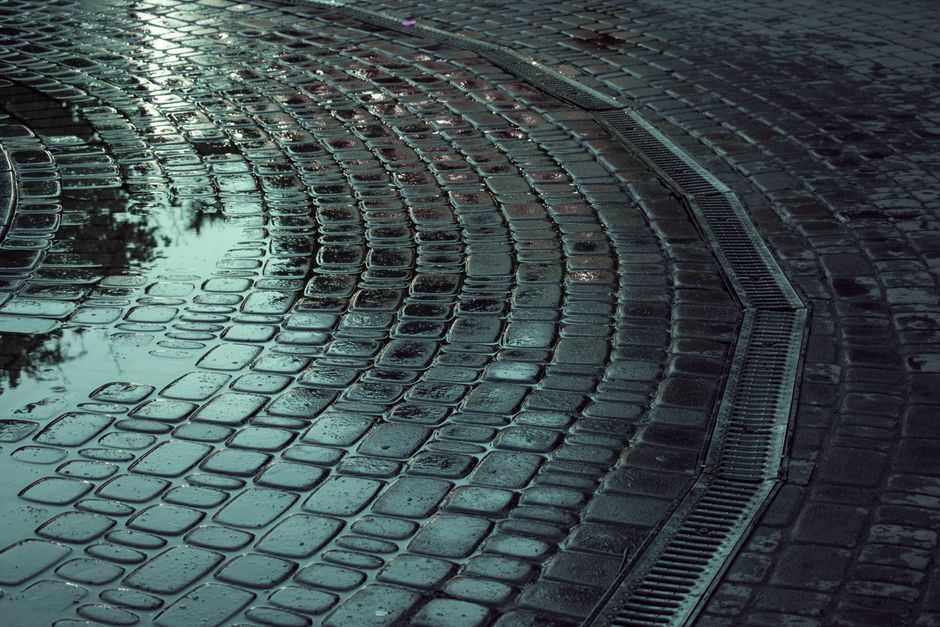Runoff beside a tunnel entrance during heavy rain