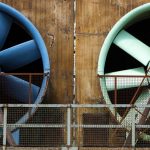 Jet fans installed along a road tunnel ceiling