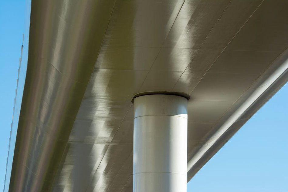 Engineer inspecting bridge bearing movement after seismic loading