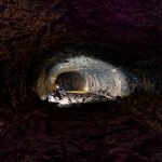 Engineers assess exposed ground at a tunnel face