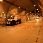engineers using advanced diagnostic tools to inspect a tunnel