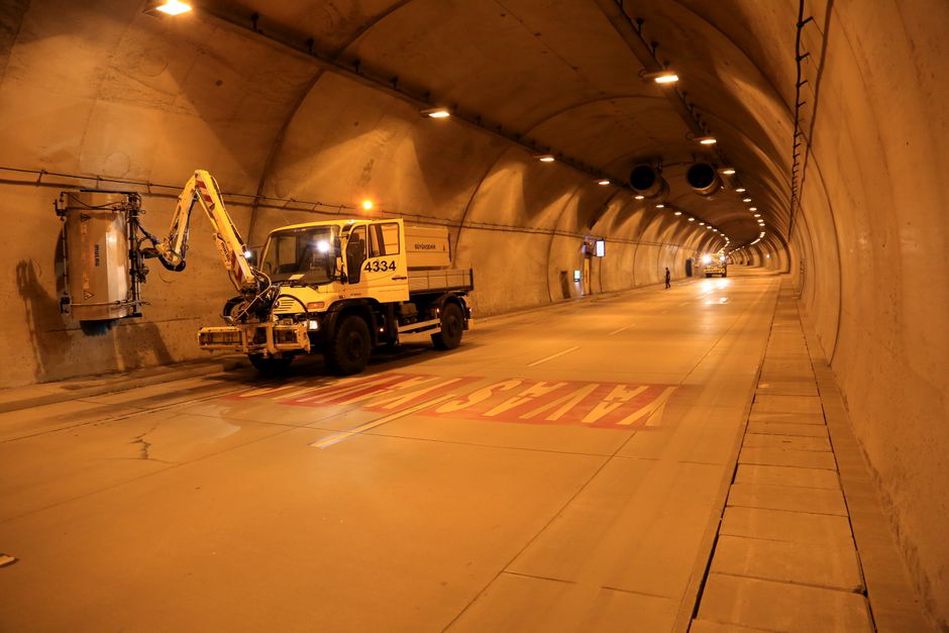 engineers using advanced diagnostic tools to inspect a tunnel