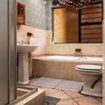 Flat bath mat beside a dry shower floor