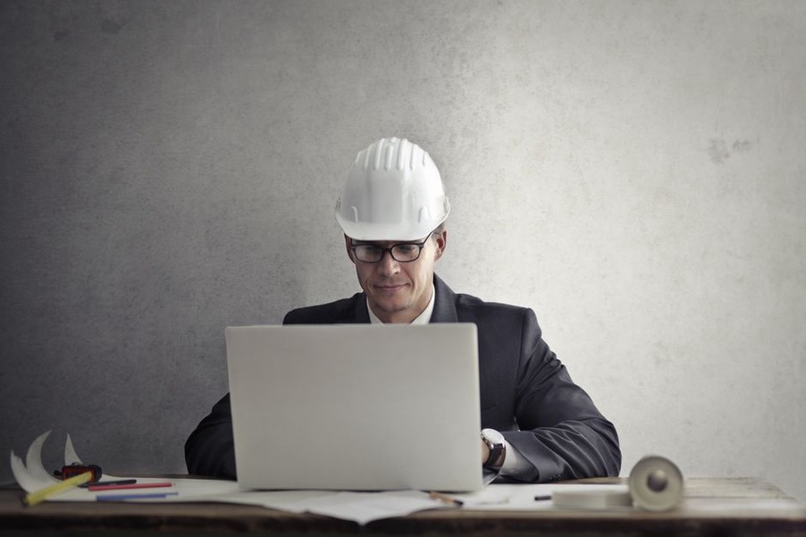 Engineer checks inspection findings beside field notes