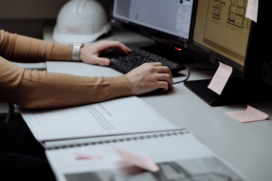 Engineer checks monitoring records against an inspection report