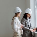 Engineer reviewing questions beside an inspection record