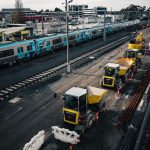 Engineer compares track measurements with inspection notes