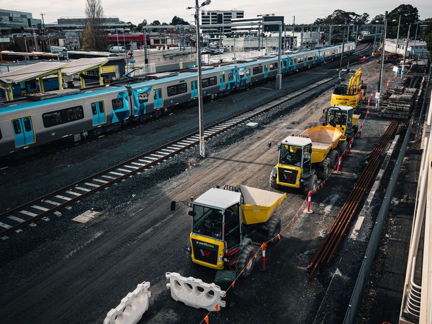 Engineer compares track measurements with inspection notes