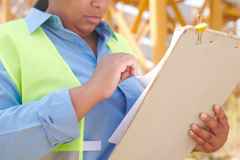 Engineers checking notes against inspection records