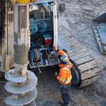 Borehole investigation beside a low coastal road