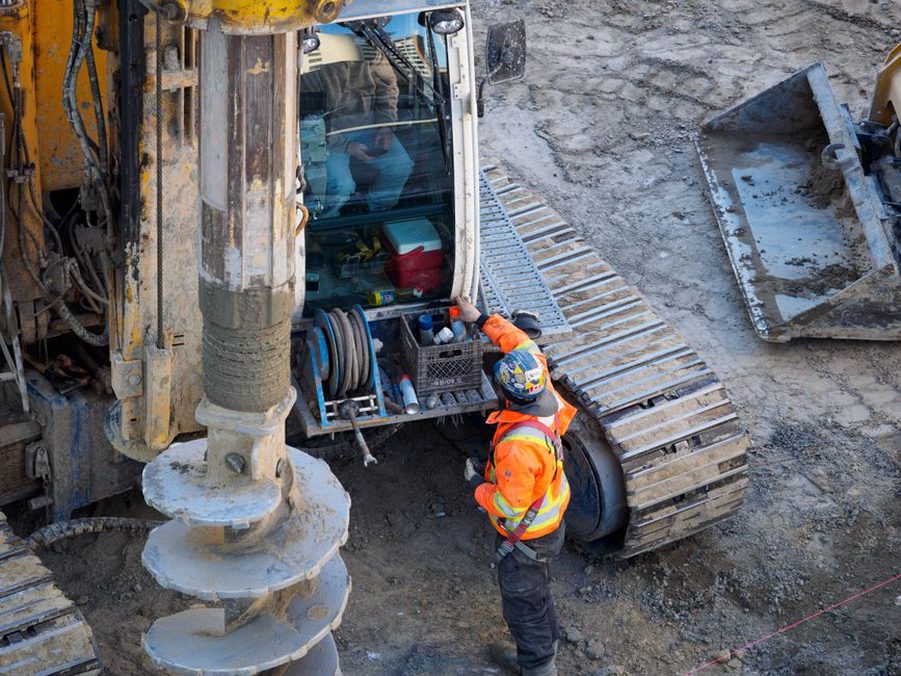 Borehole investigation beside a low coastal road